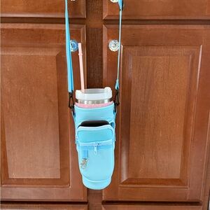 Light blue insulated 44 ounce cup holder with strap